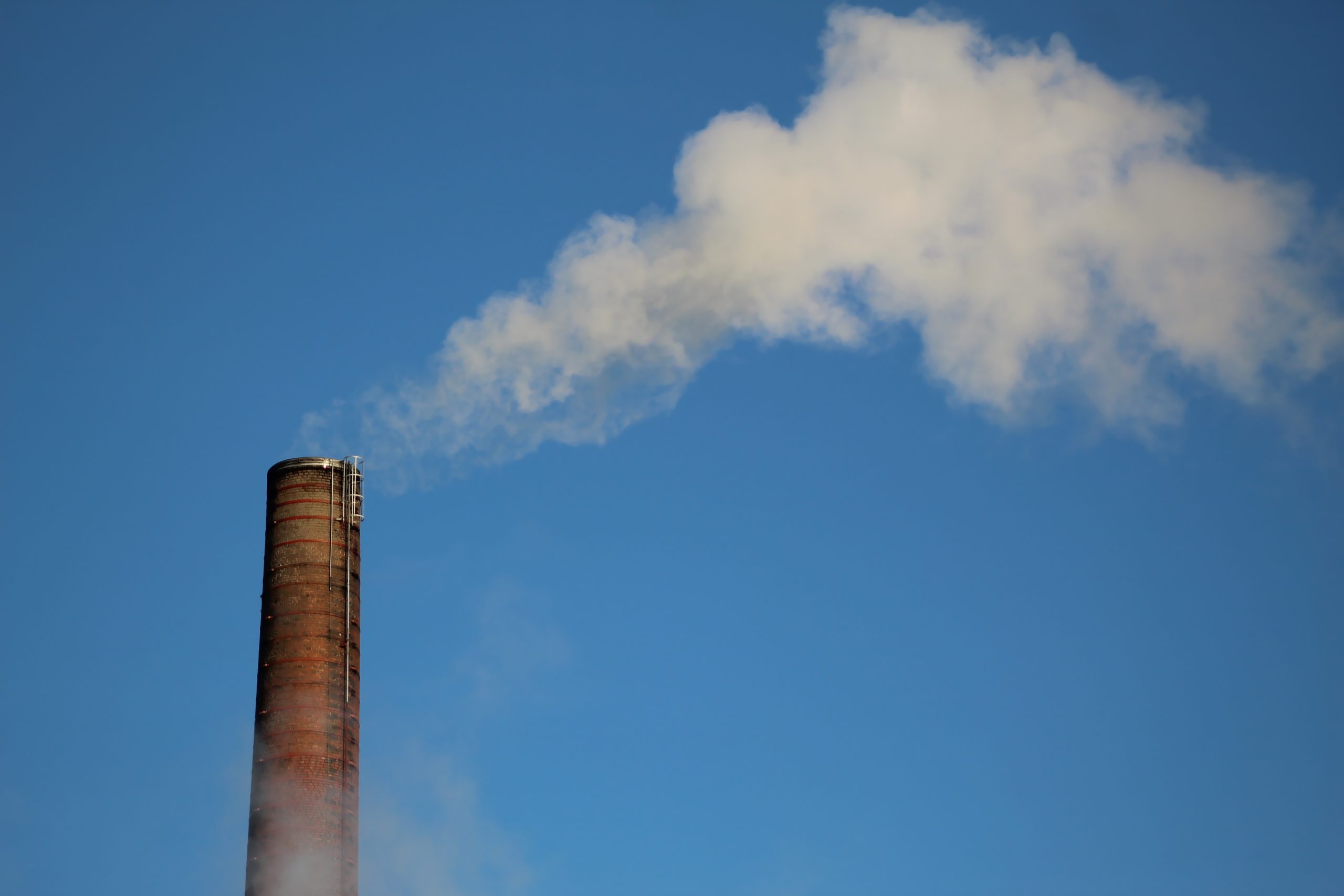 Factory chimney smoking carbon emissions