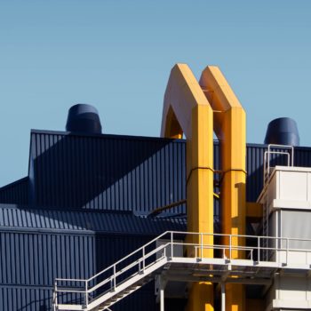 An industrial factory with yellow pipes