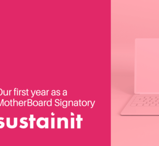 Pink laptop and title of blog - Our first year as a Motherboard signatory Sustainit